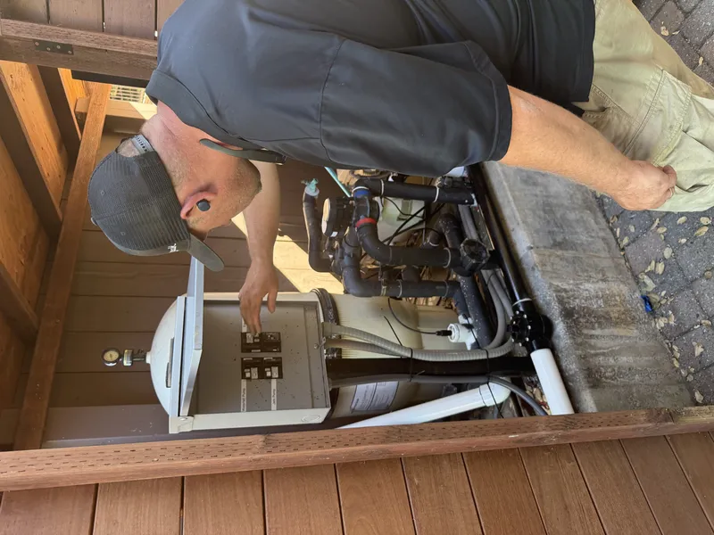 FireRoofs installer configuring pool pump integration for backup water supply