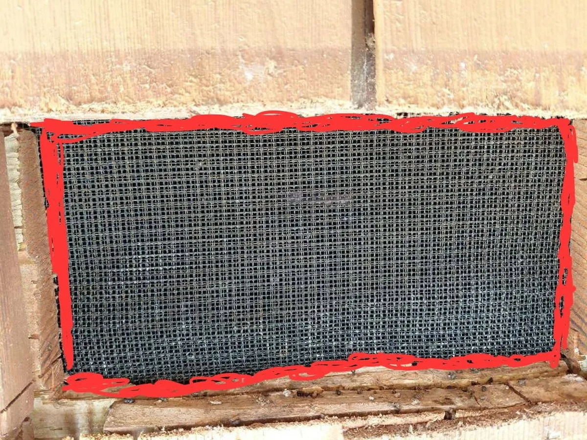 Securing and sealing stainless ember mesh behind a vent on a Portola Valley home