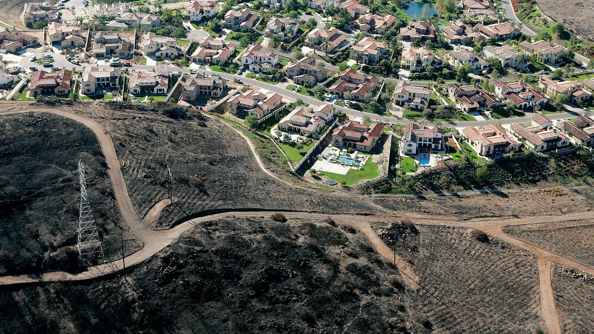 Hillside neighborhood in the San Ramon wildland-urban interface showing homes among natural vegetation