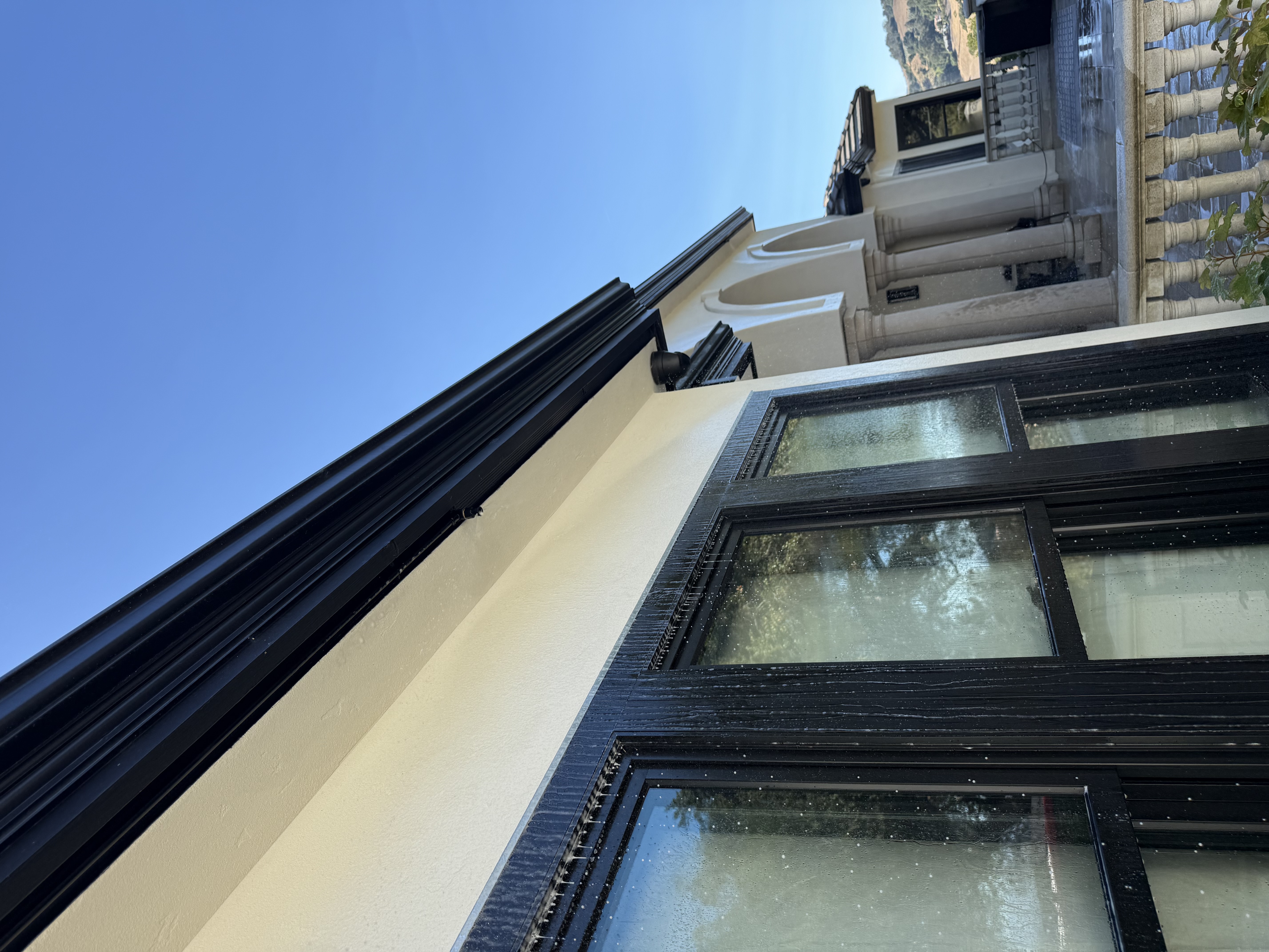 FireRoofs eave-mounted sprinklers protecting windows and siding