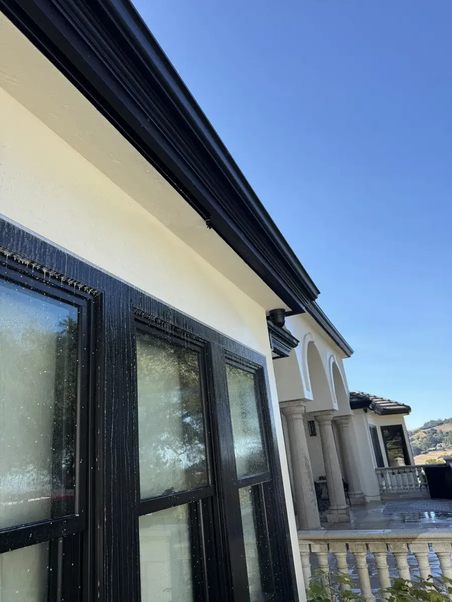 FireRoofs eave-mounted sprinklers protecting windows and siding