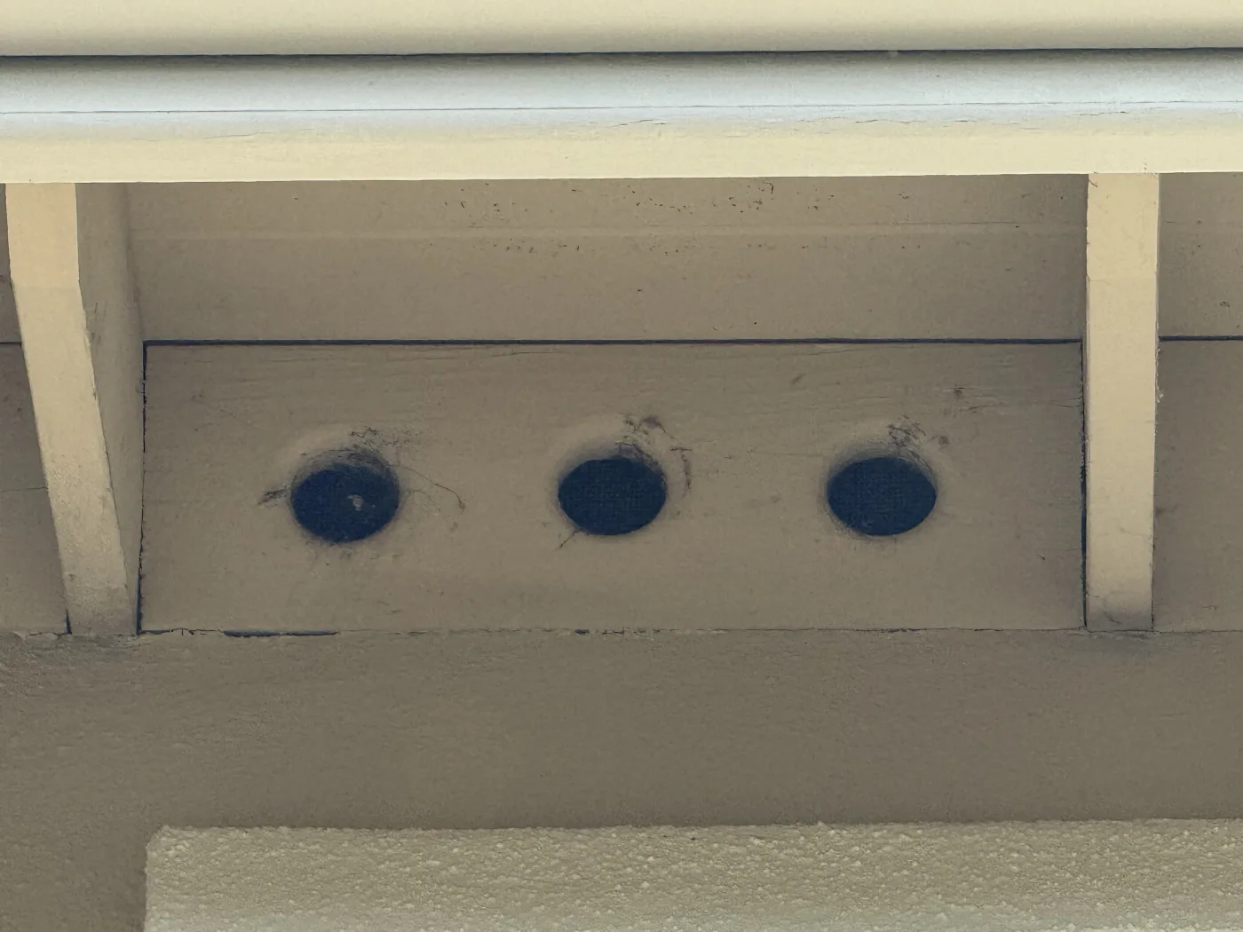 Round eave vents with coarse screen draw embers straight into the attic and roof structure during a fire.