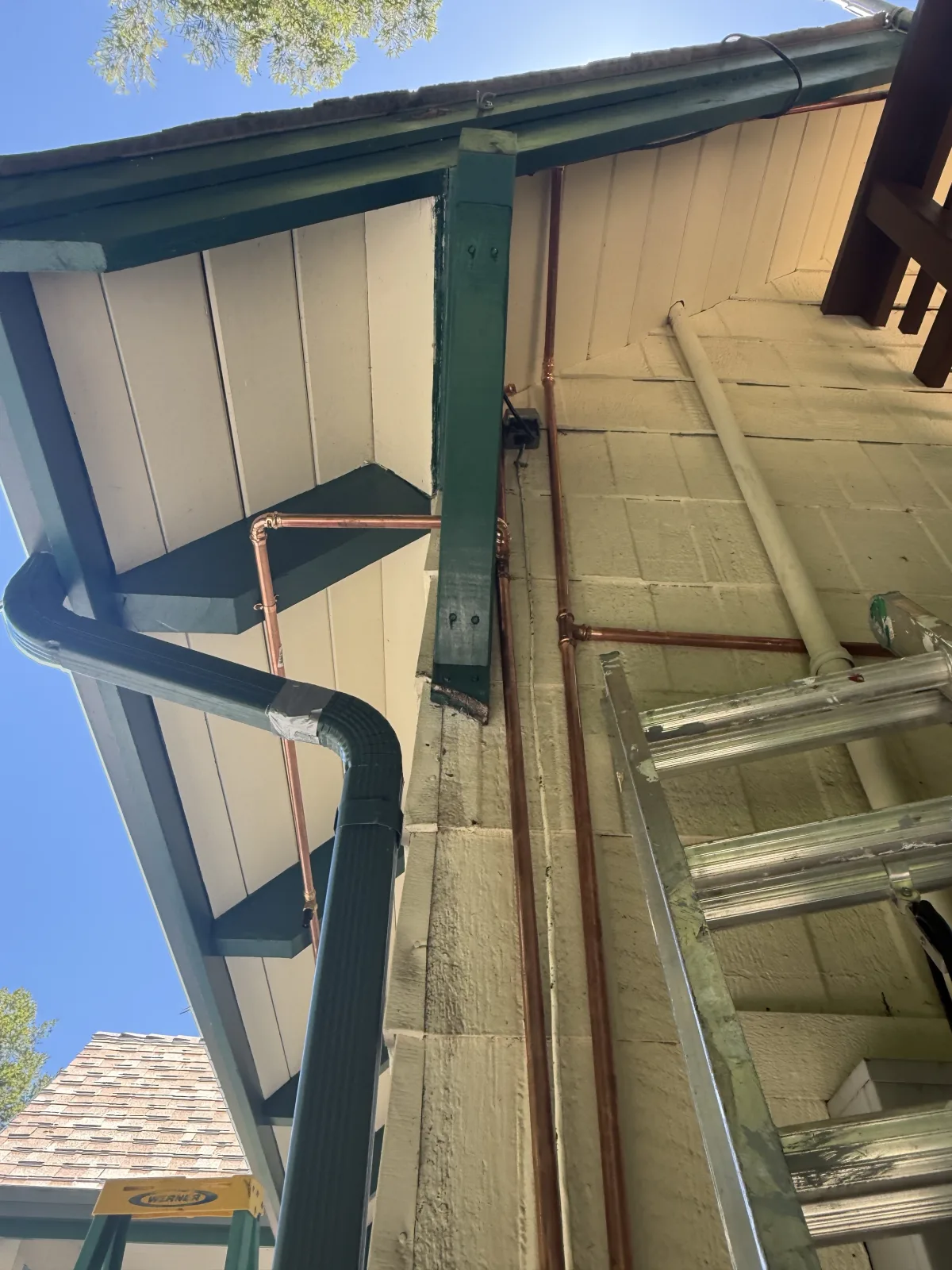Copper piping running along the eaves of a Santa Cruz Mountains cabin